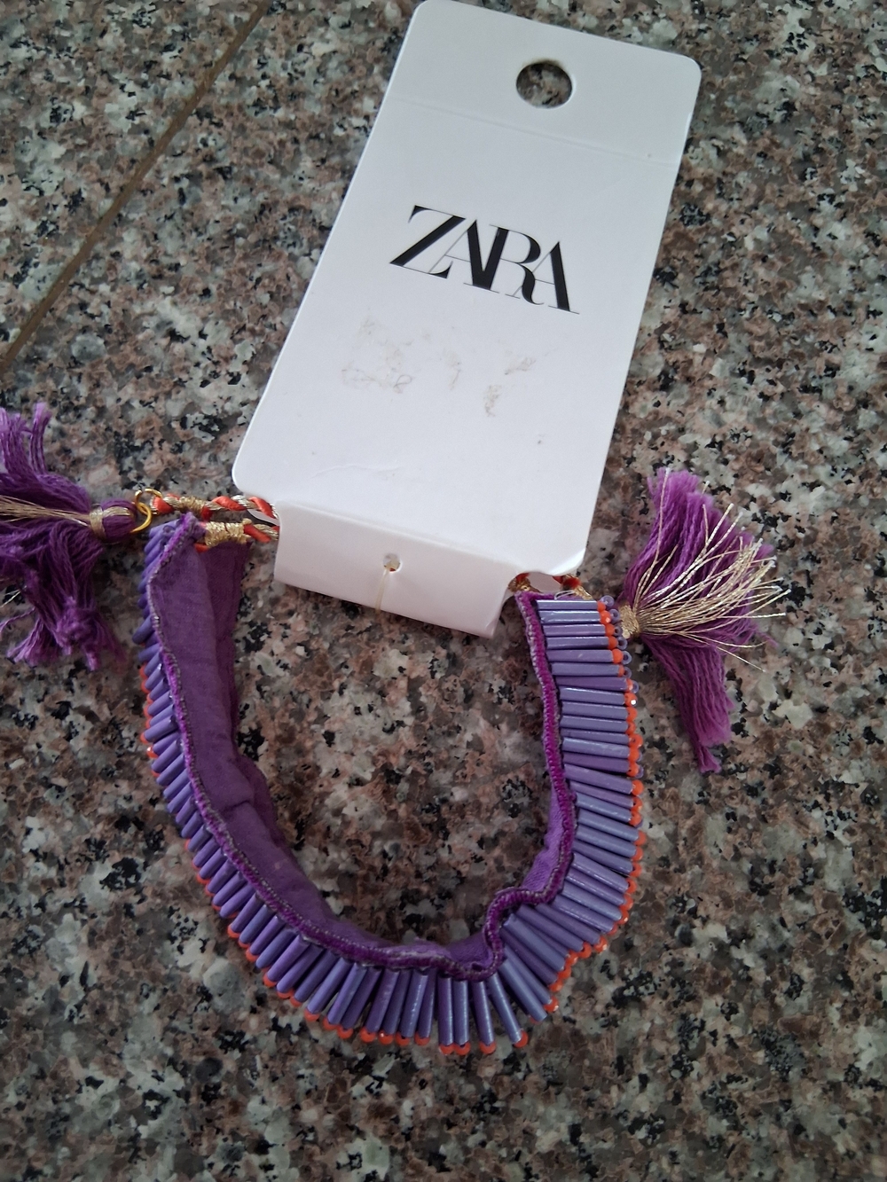 ZARA Purple Beaded Tassel Bracelet Accessory with Orange Accent.
